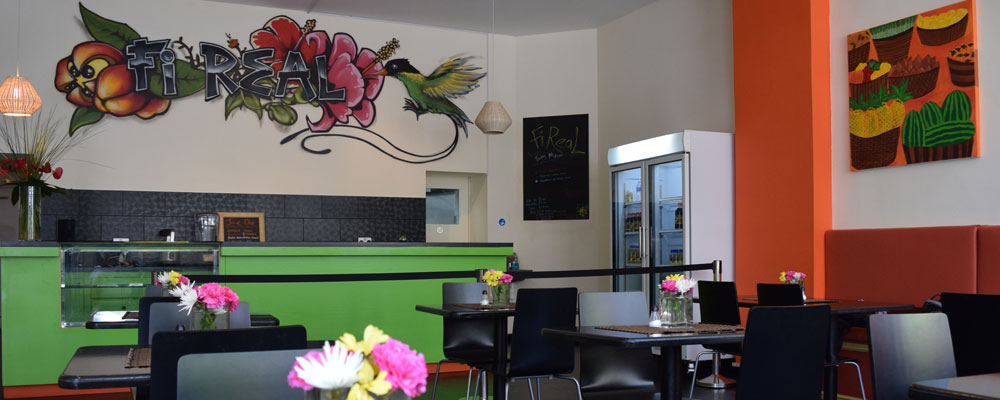 Inside Fi Real on West Street: the hand-painted Fi Real mural above the counter